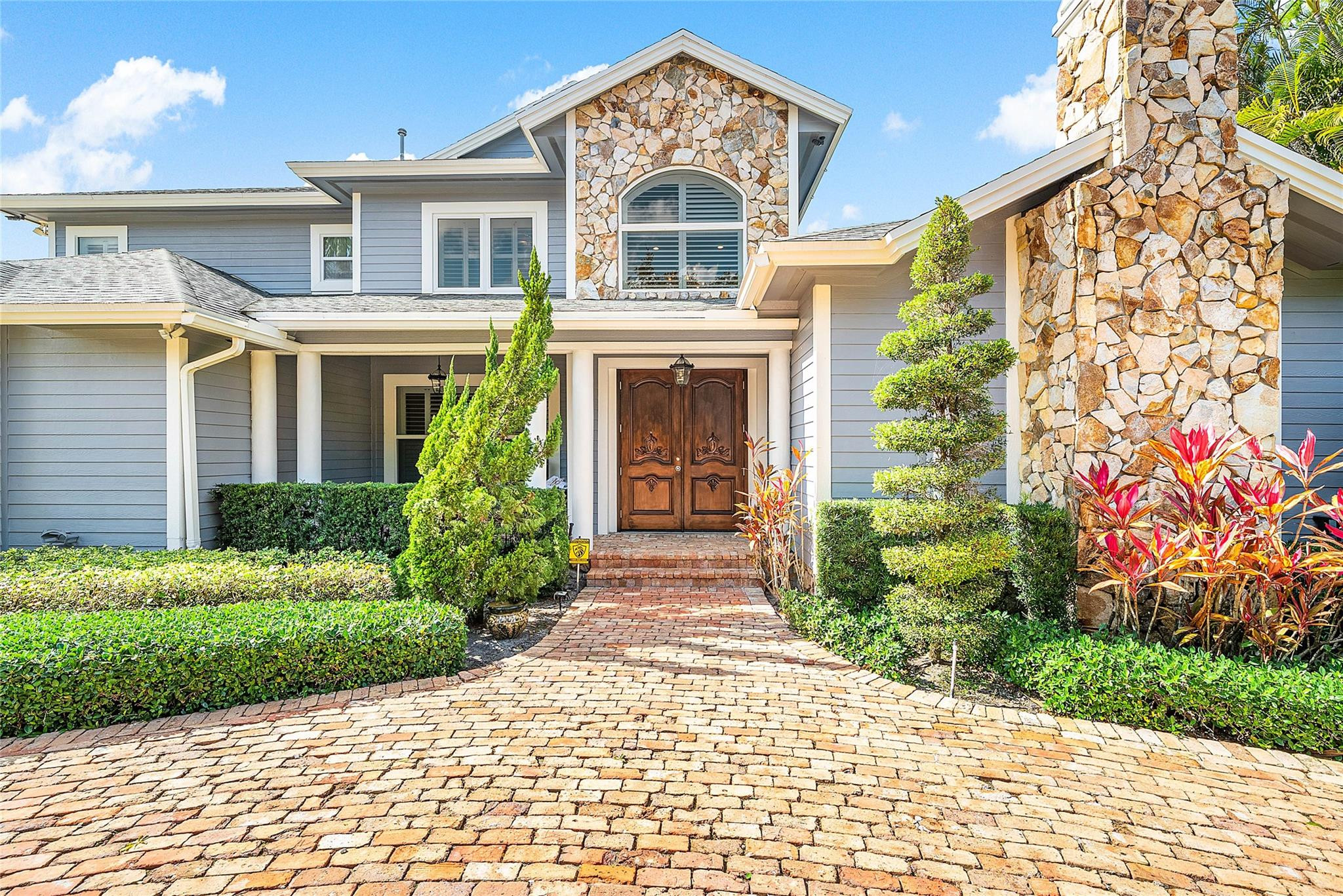 8035 Dillman Road West Palm Beach, FL 33411 - Photo 13 of 70 a front view of a house with garden
