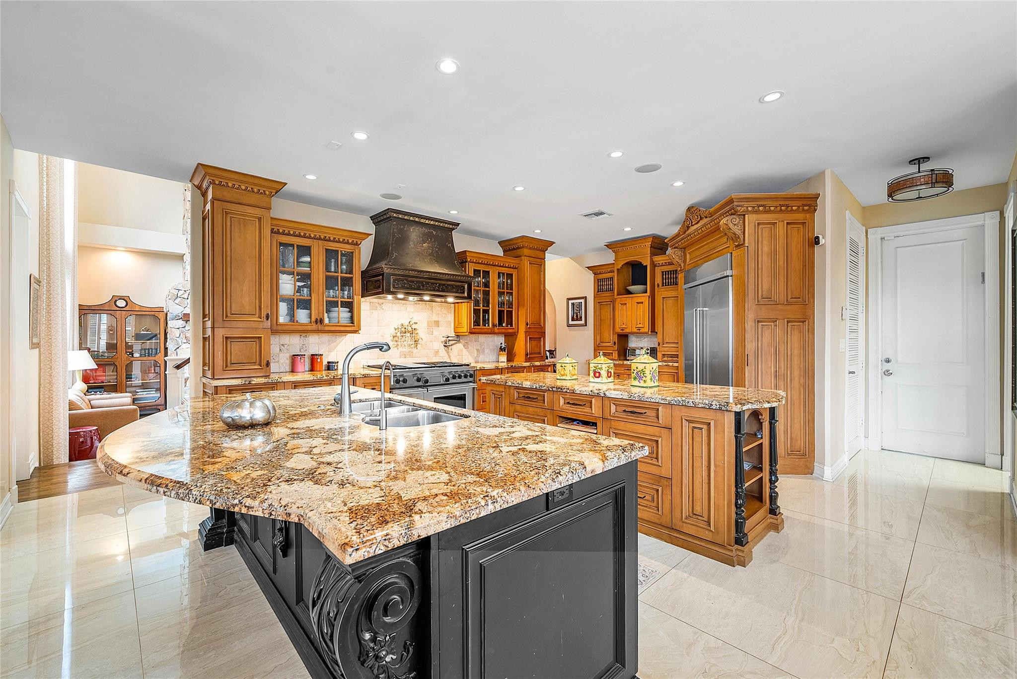 8035 Dillman Road West Palm Beach, FL 33411 - Photo 22 of 70 a open kitchen with stainless steel appliances granite countertop a table and chairs in it
