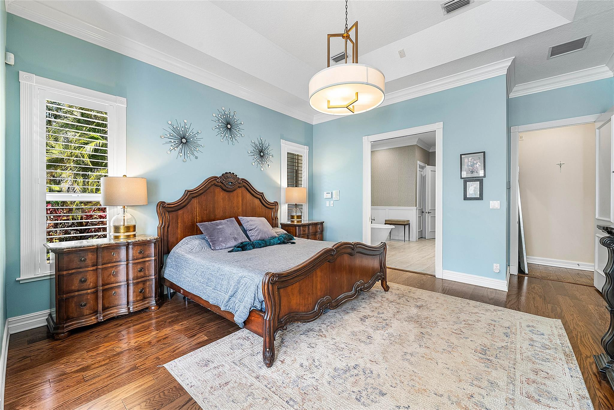 8035 Dillman Road West Palm Beach, FL 33411 - Photo 27 of 70 a bedroom with a bed and wooden floor