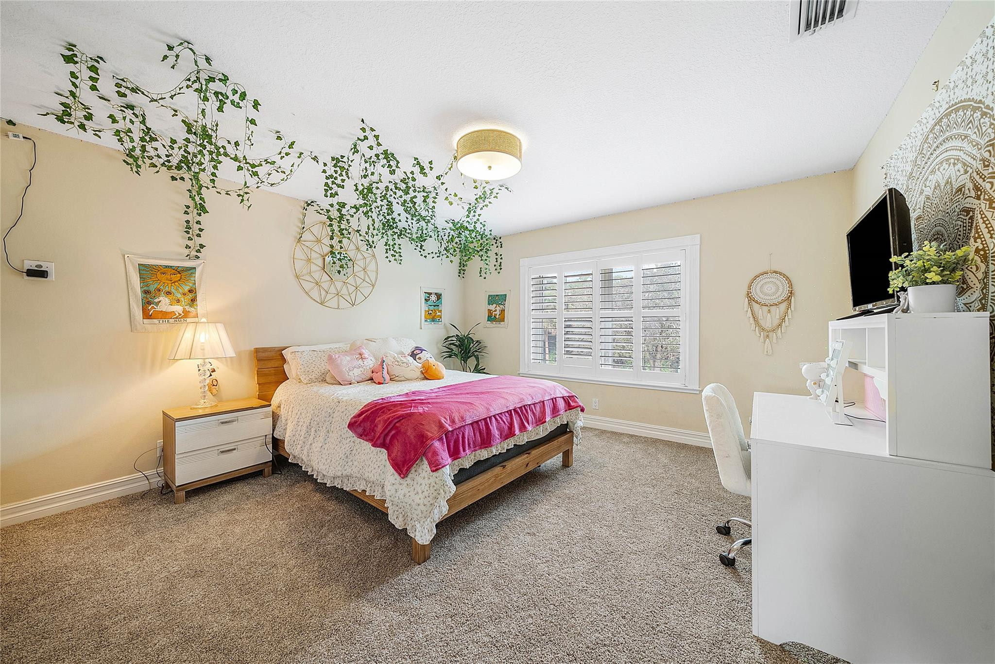 8035 Dillman Road West Palm Beach, FL 33411 - Photo 34 of 70 a spacious bedroom with a bed and a window