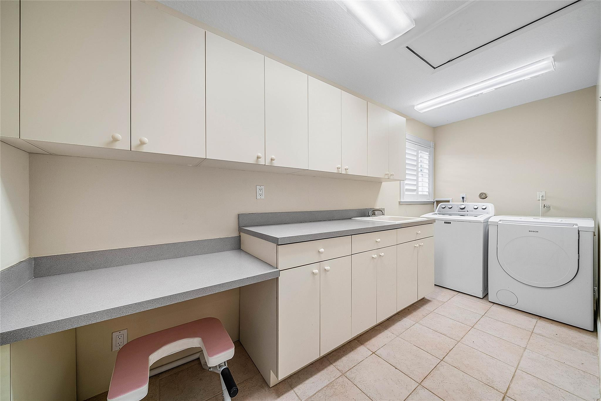 8035 Dillman Road West Palm Beach, FL 33411 - Photo 41 of 70 a utility room with cabinets washer and dryer
