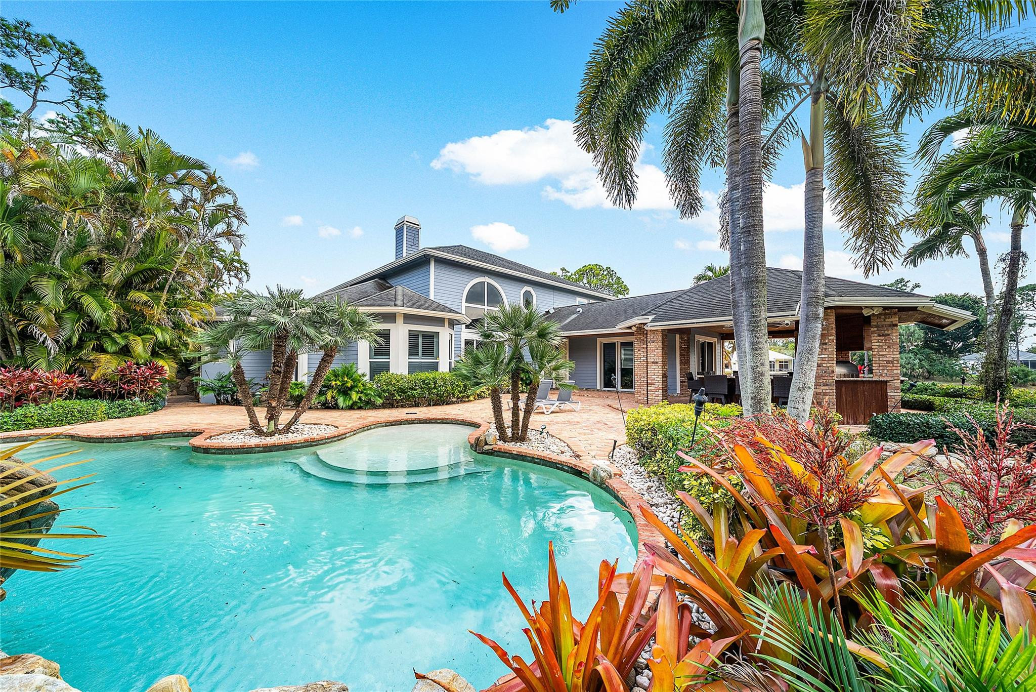 8035 Dillman Road West Palm Beach, FL 33411 - Photo 5 of 70 a view of a house with swimming pool and sitting area
