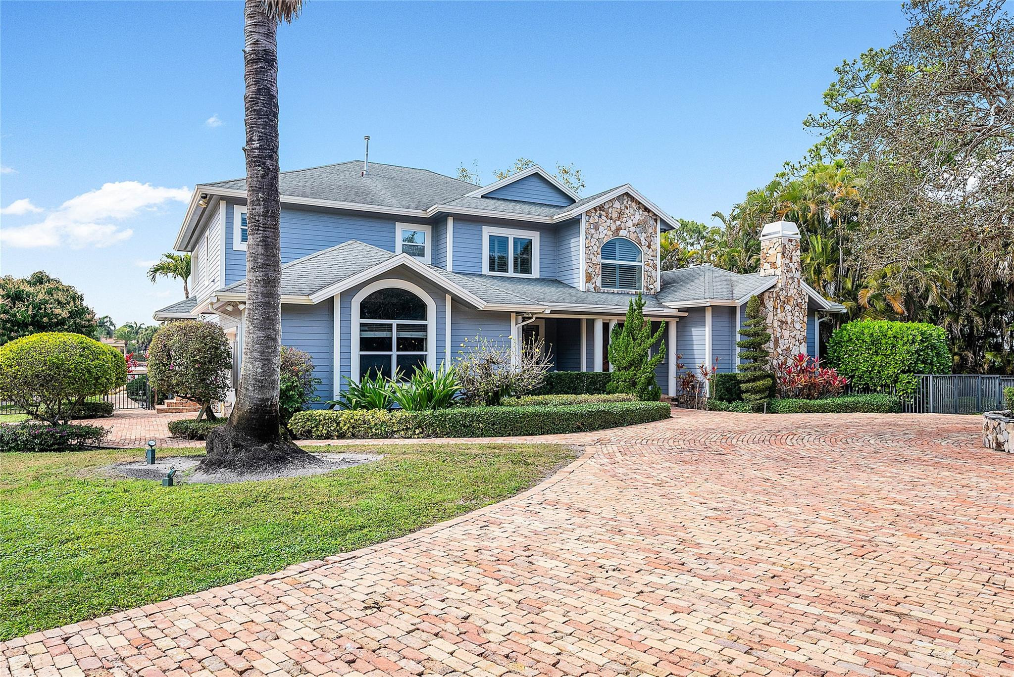 8035 Dillman Road West Palm Beach, FL 33411 - Photo 56 of 70 a front view of a house with garden