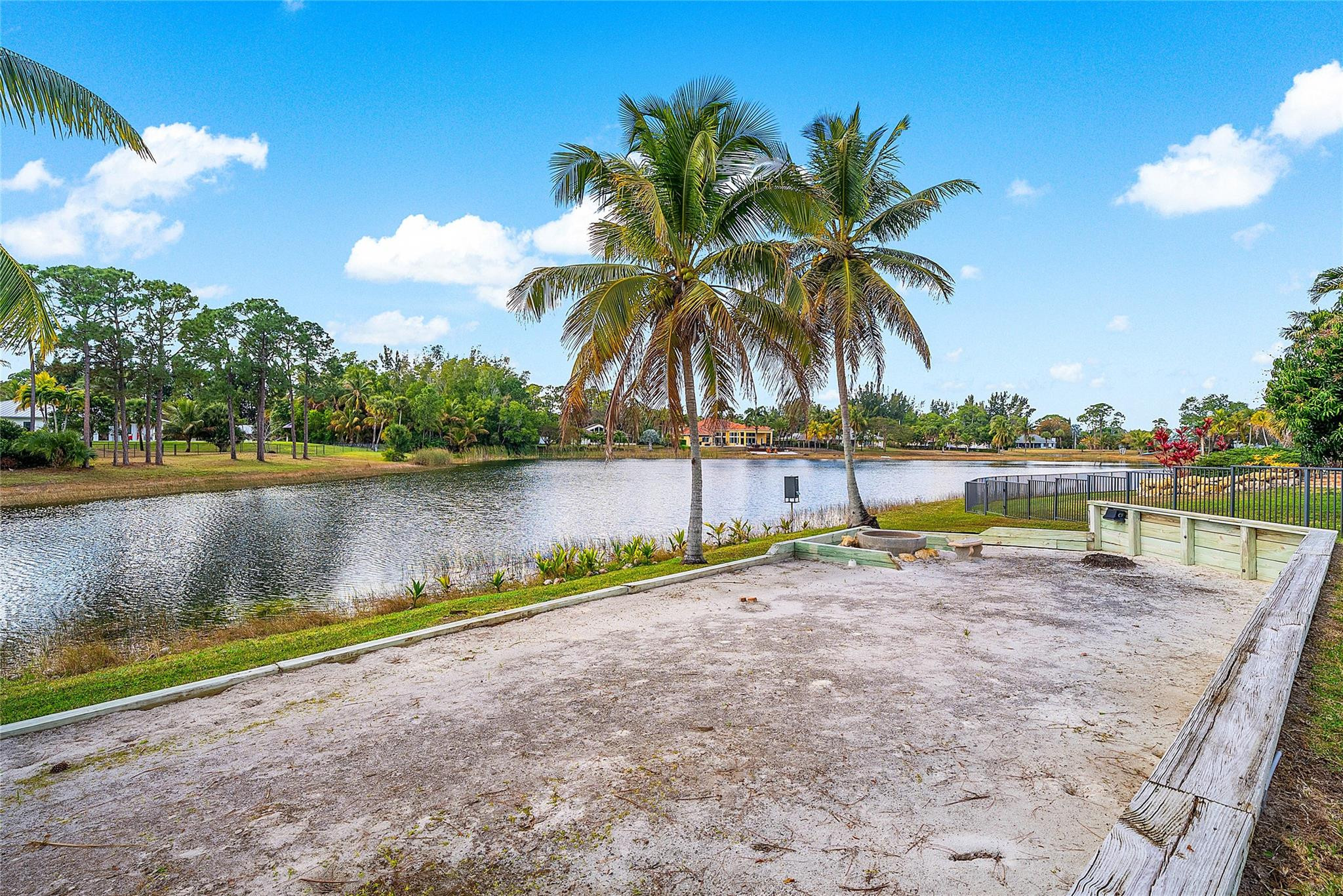 8035 Dillman Road West Palm Beach, FL 33411 - Photo 60 of 70 a view of a lake with a palm tree