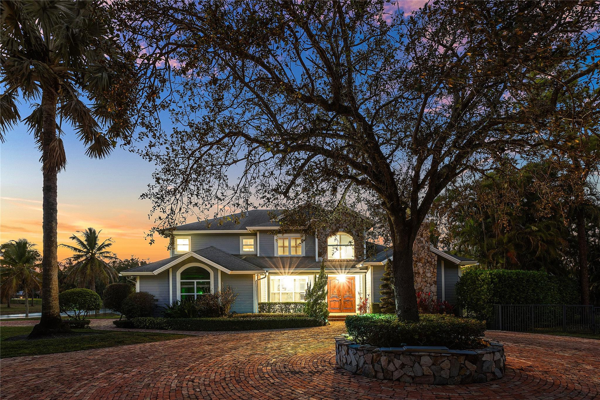 8035 Dillman Road West Palm Beach, FL 33411 - Photo 63 of 70 a front view of a house with a yard