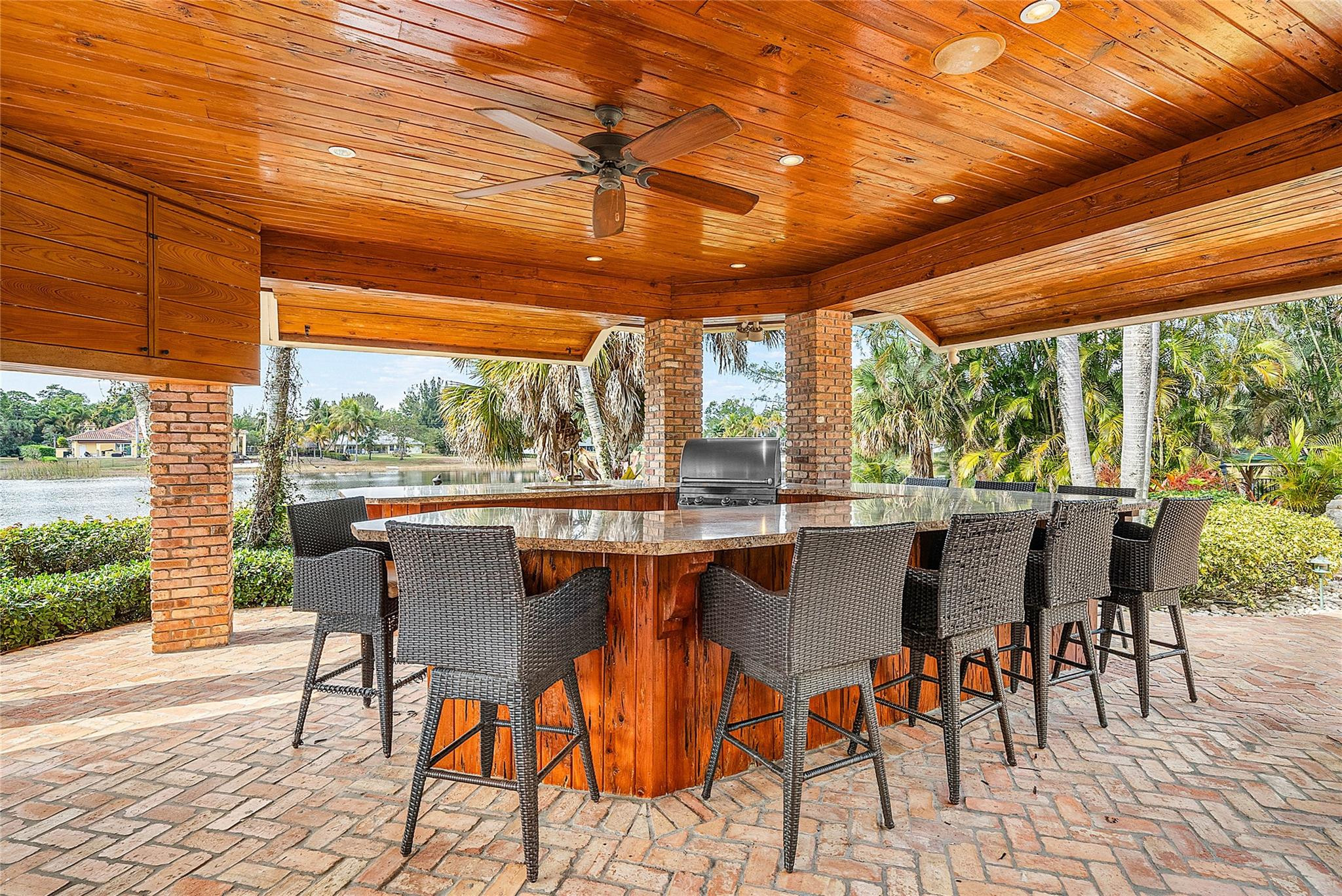 8035 Dillman Road West Palm Beach, FL 33411 - Photo 65 of 70 a view of a patio with a table chairs and backyard