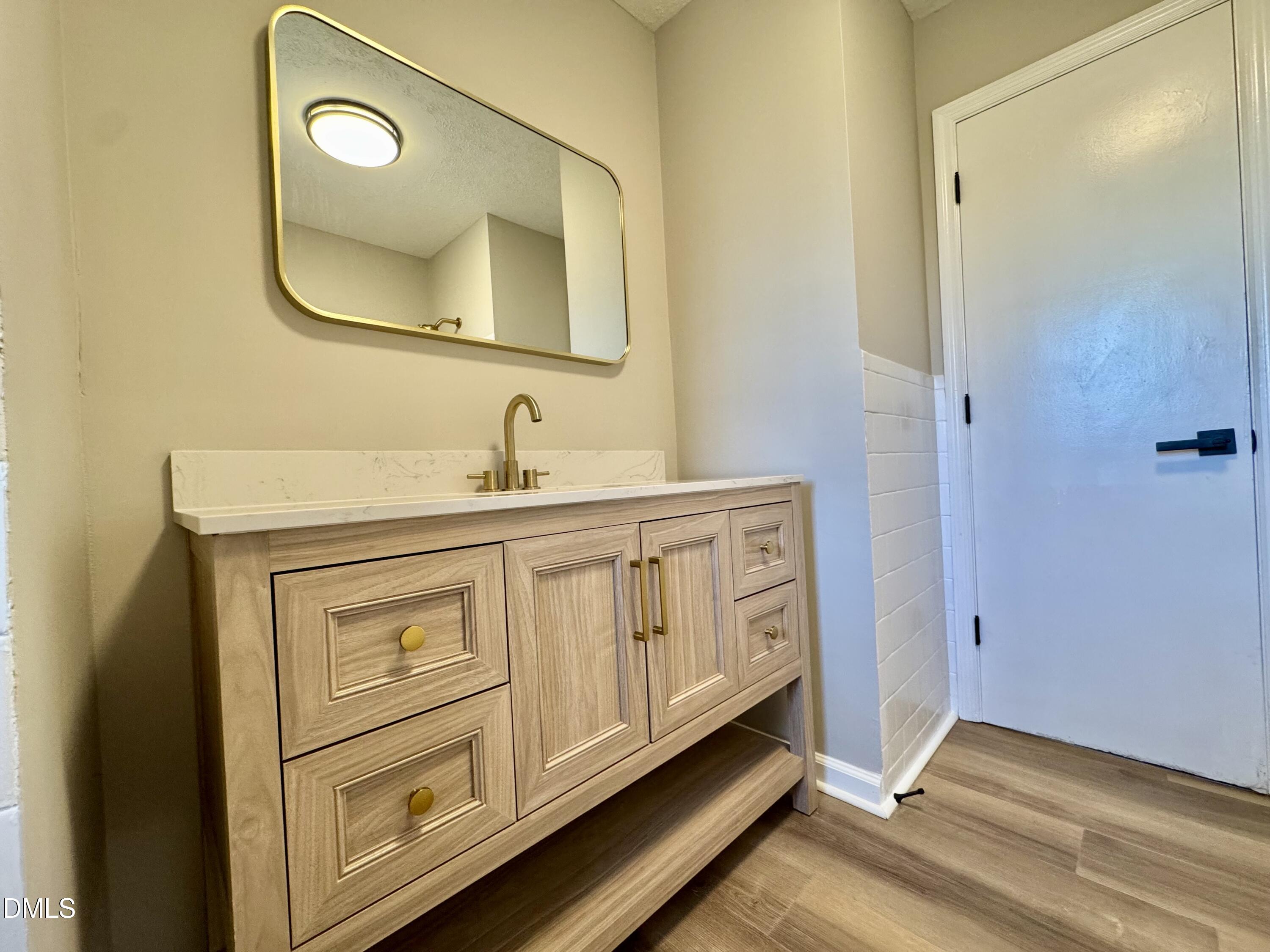 727 High Rock School Road Blanch, NC 27212 - Photo 12 of 29 a bathroom with a granite countertop toilet sink and mirror