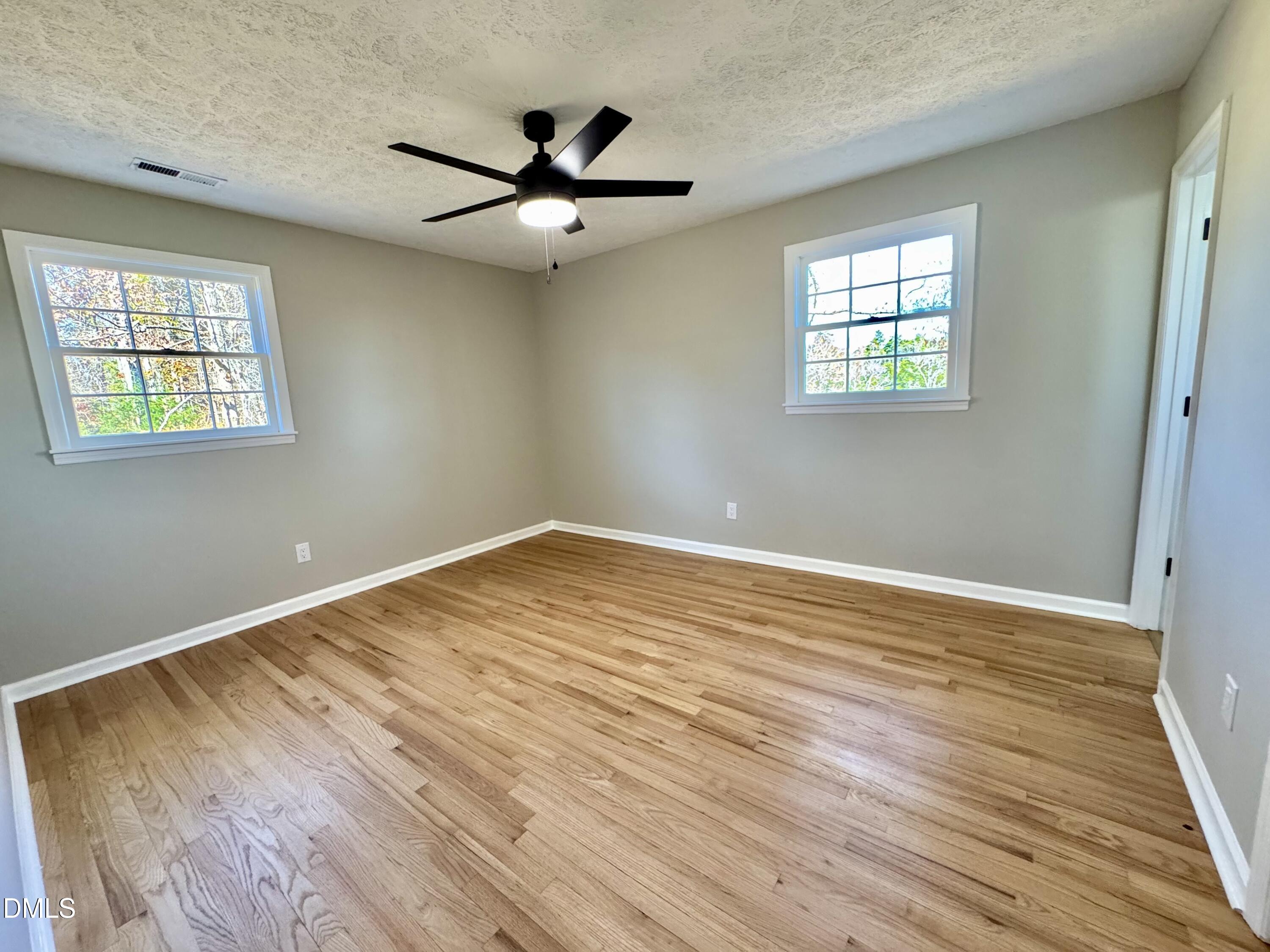 727 High Rock School Road Blanch, NC 27212 - Photo 15 of 29 a view of empty room with wooden floor