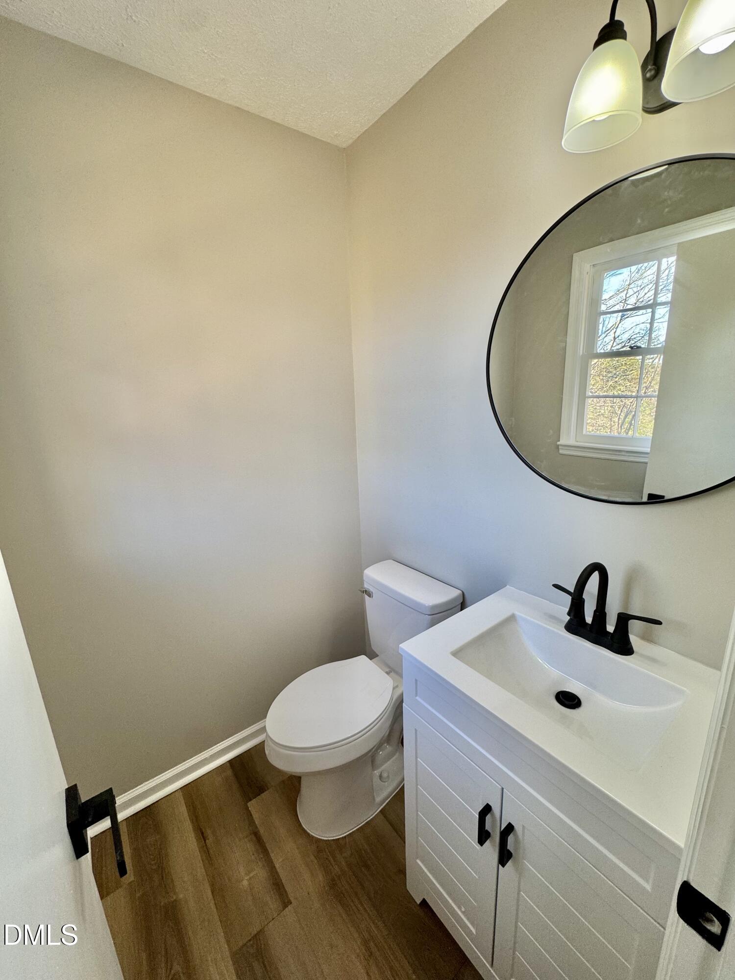727 High Rock School Road Blanch, NC 27212 - Photo 17 of 29 a bathroom with a sink and a mirror