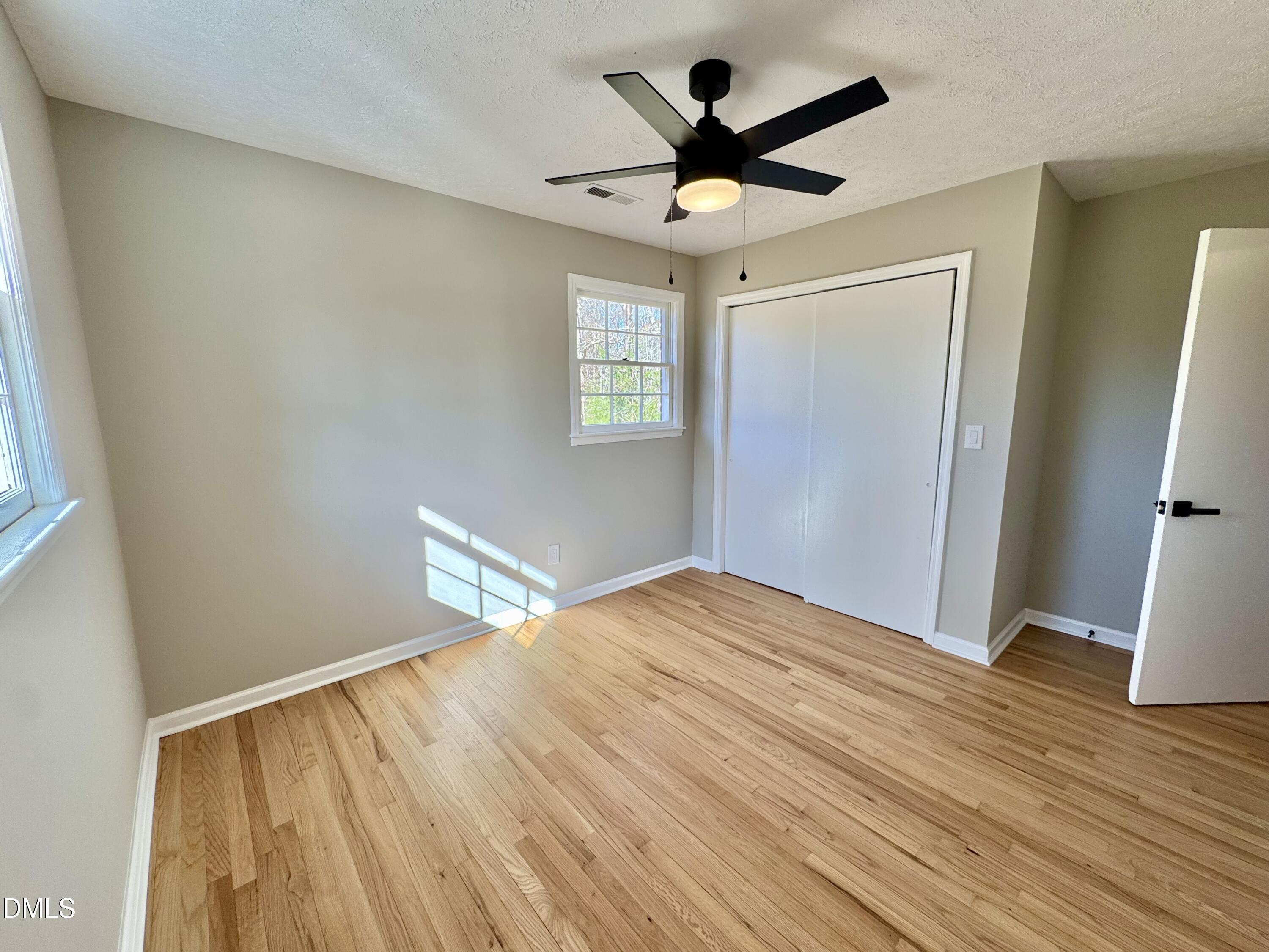 727 High Rock School Road Blanch, NC 27212 - Photo 19 of 29 a view of empty room with wooden floor