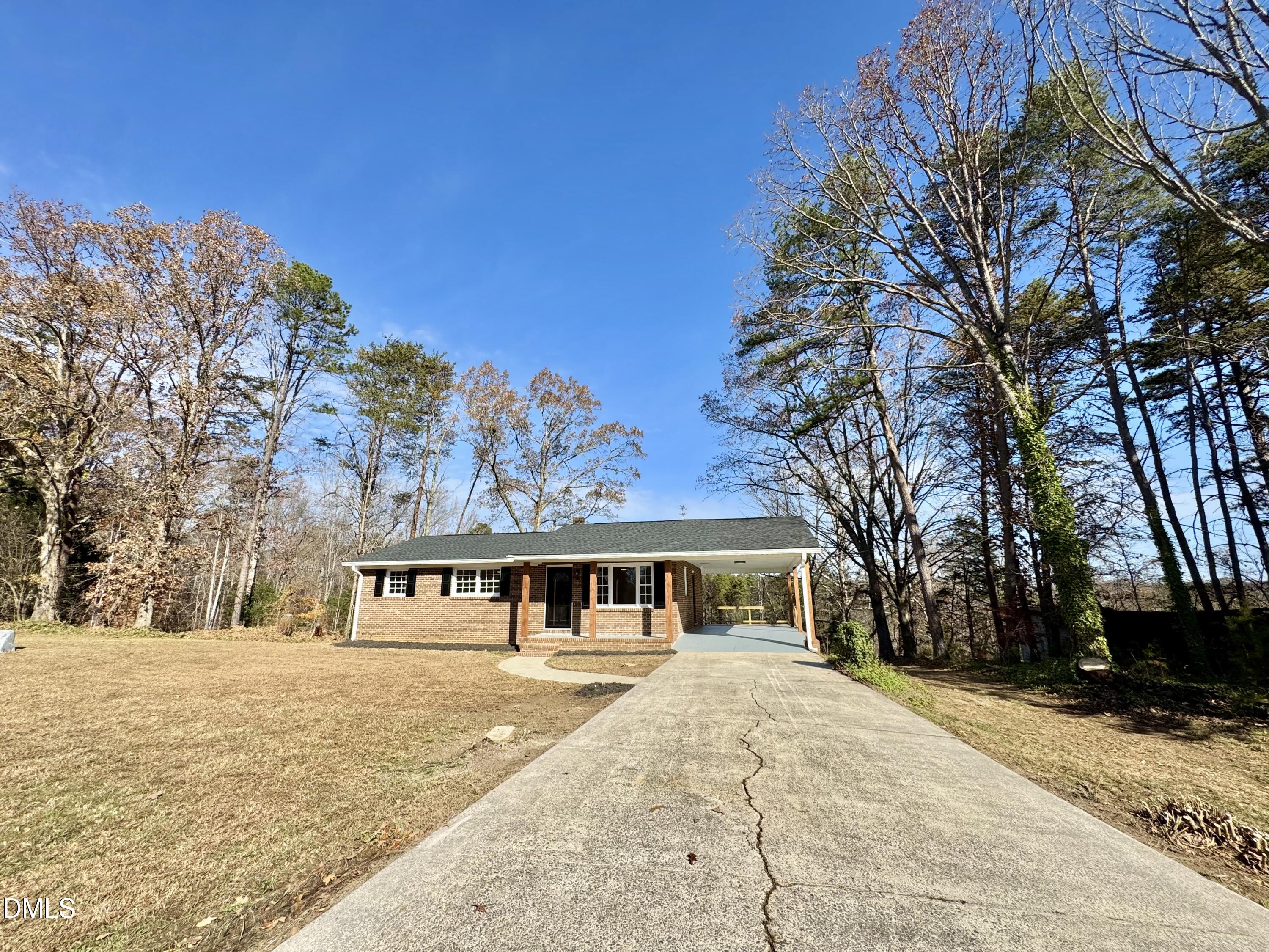 727 High Rock School Road Blanch, NC 27212 - Photo 24 of 29 a front view of a house with a yard