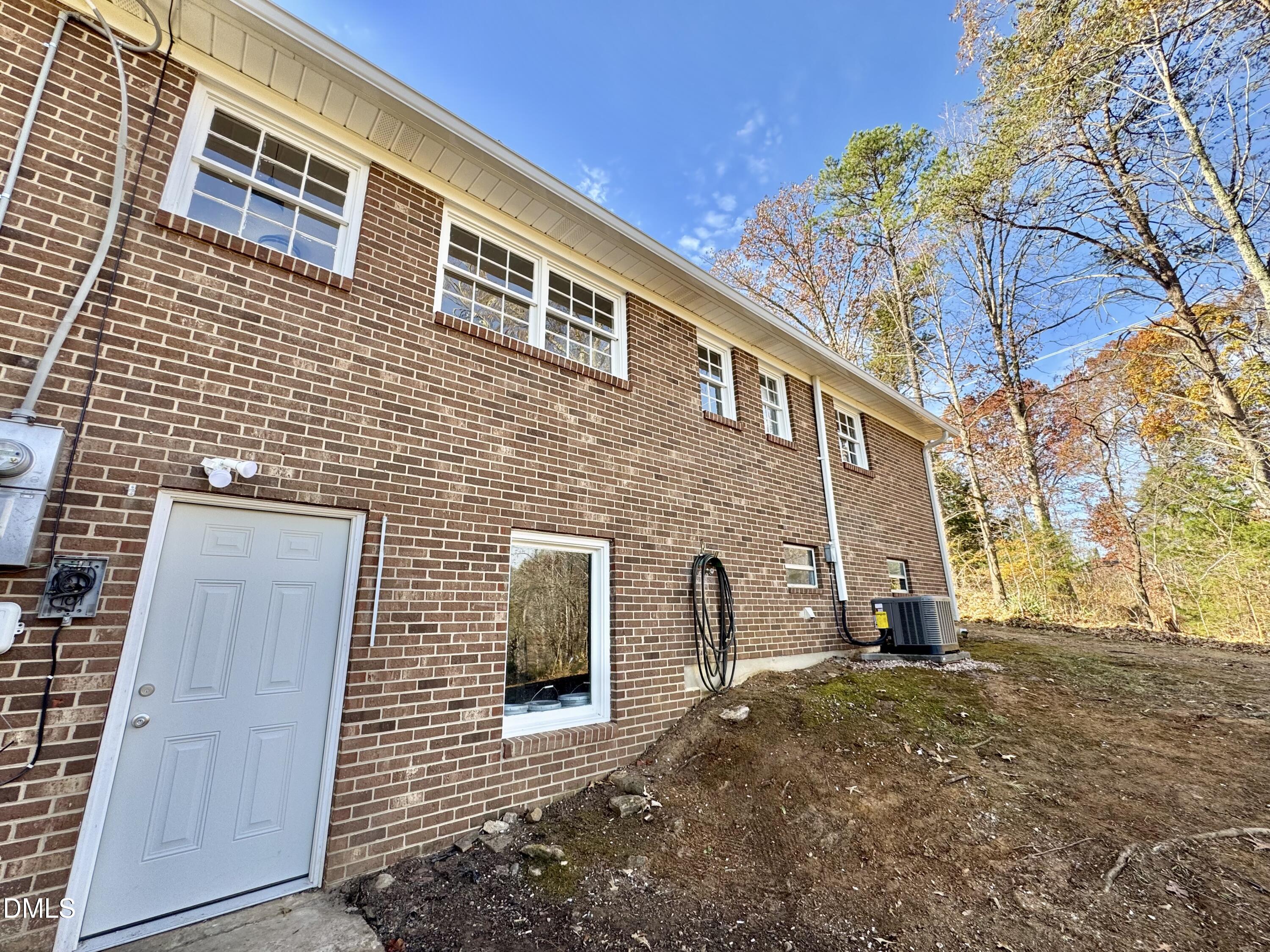 727 High Rock School Road Blanch, NC 27212 - Photo 29 of 29 a backyard of a house with barbeque oven and outdoor seating