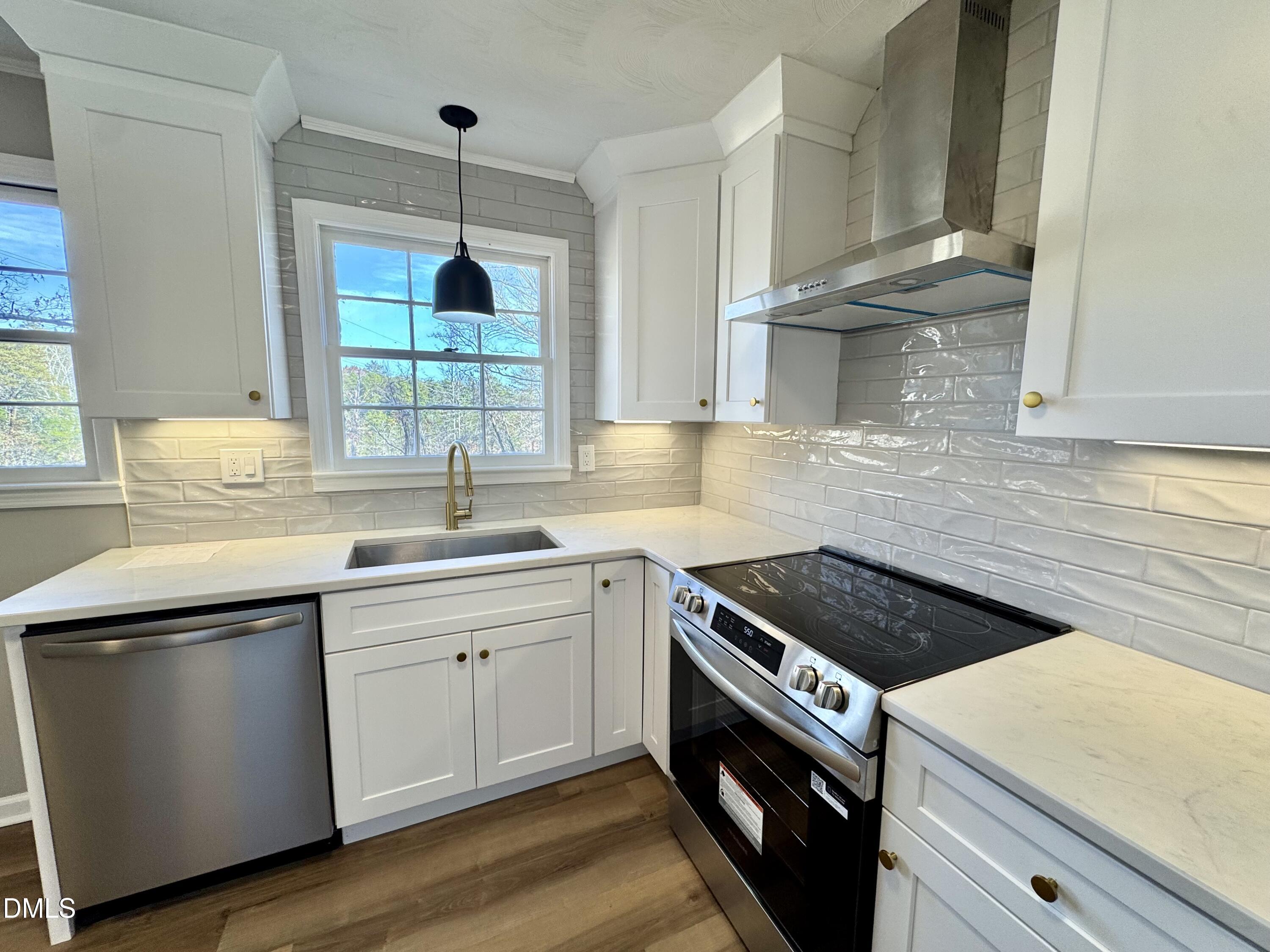 727 High Rock School Road Blanch, NC 27212 - Photo 7 of 29 a kitchen with a sink stove and cabinets