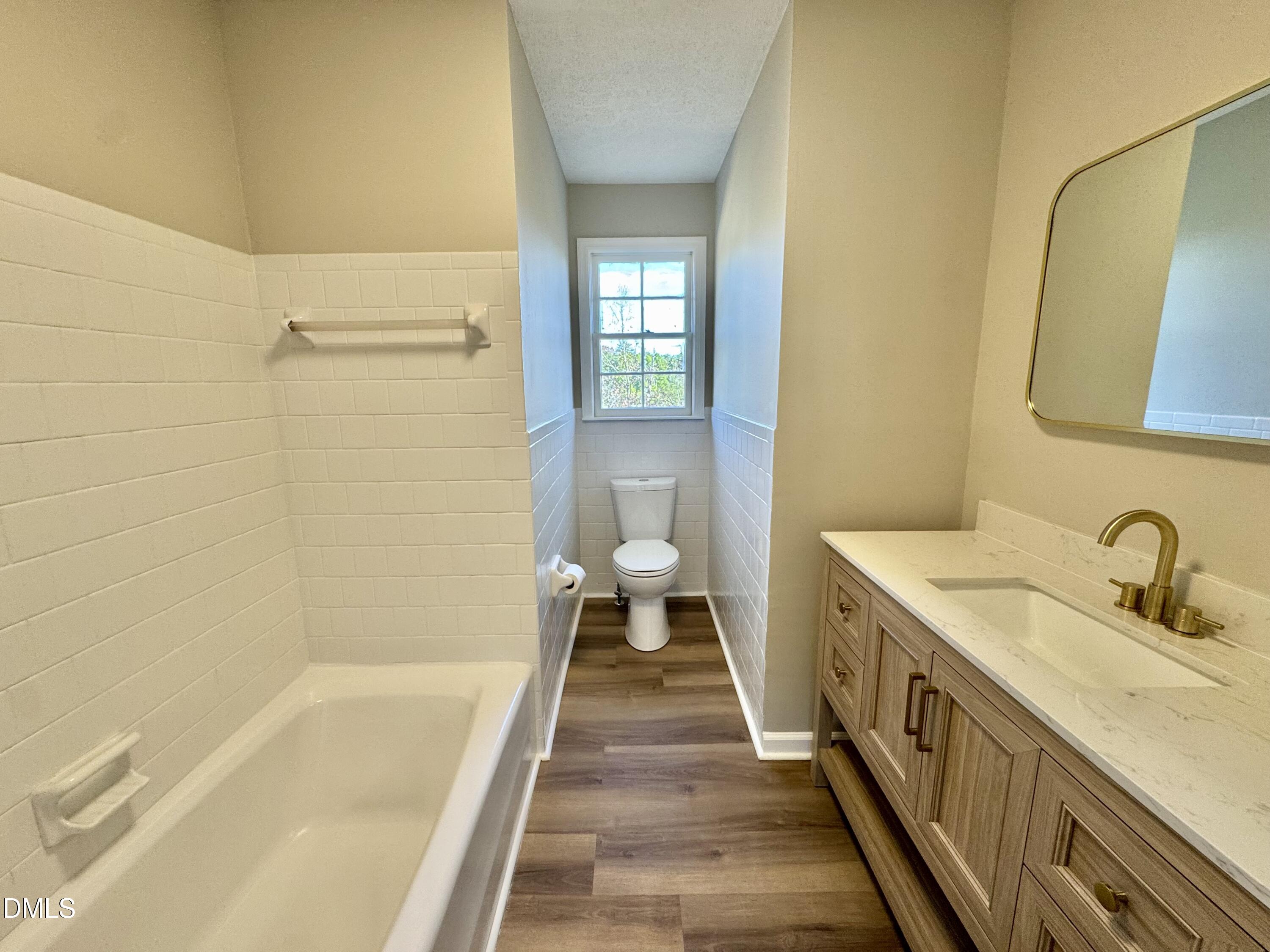 727 High Rock School Road Blanch, NC 27212 - Photo 10 of 29 a bathroom with a granite countertop sink a toilet and shower