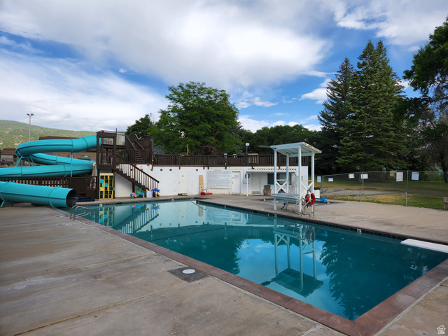 12615 Cedar Ridge Drive, Unit C41 Fairview, UT 84629 - Photo 27 of 32 Community pool featuring a water slide, a patio, and a diving board