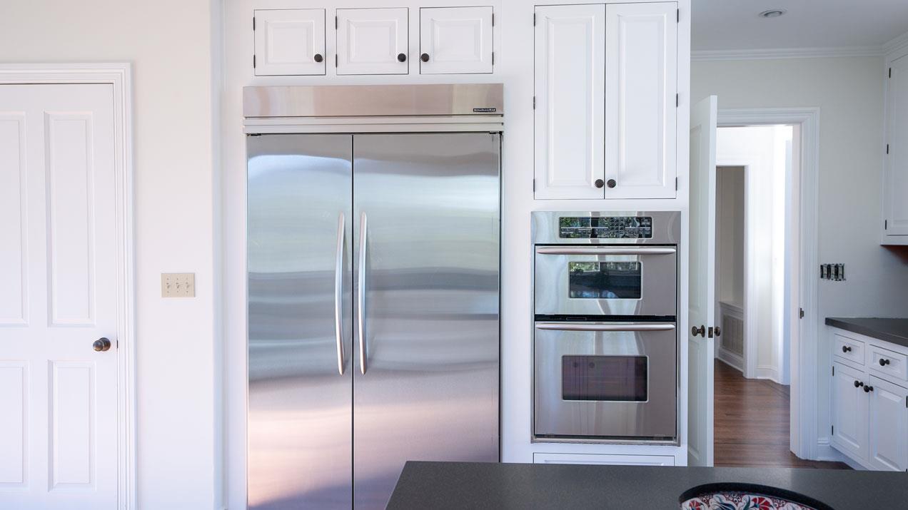 189 Kent Road Pacifica, CA 94044 - Photo 8 of 15 a kitchen with cabinets and stainless steel appliances