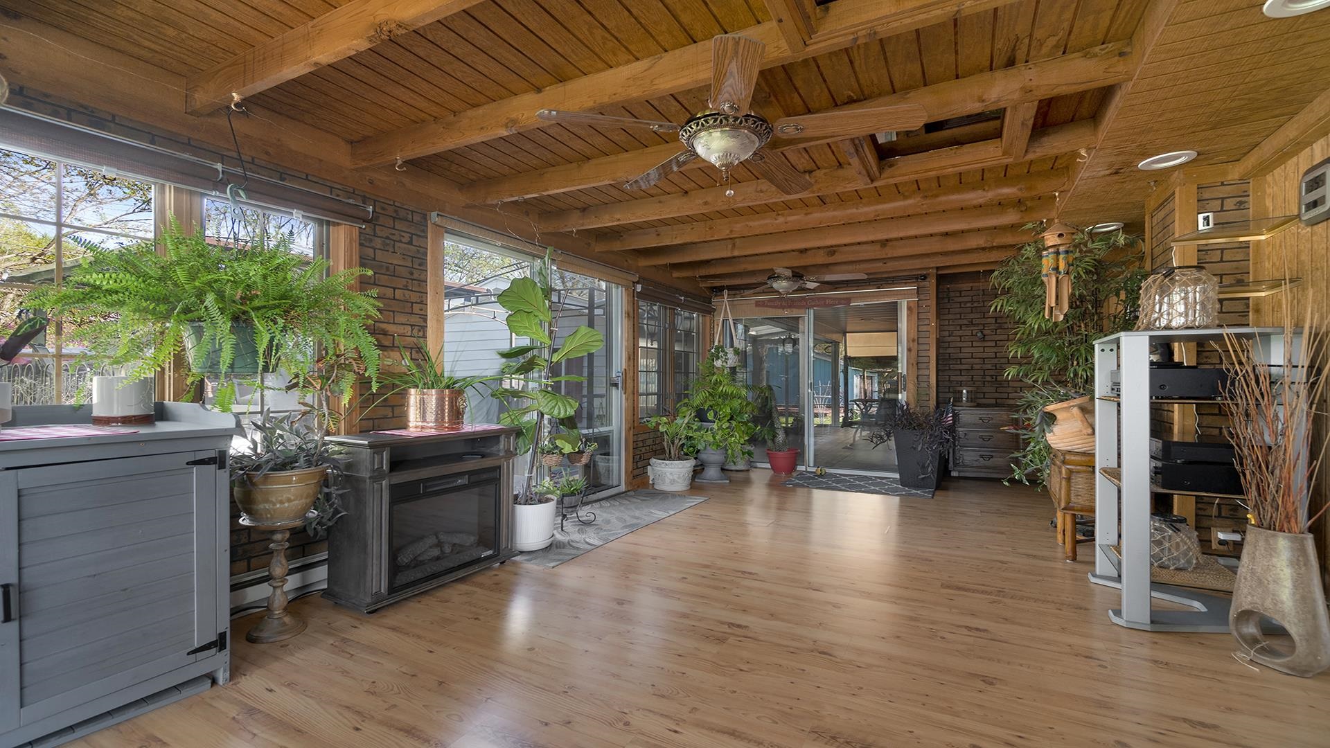 2112 South Alpine Road Rockford, IL 61108 - Photo 16 of 43 a view of a porch with furniture and a potted plant