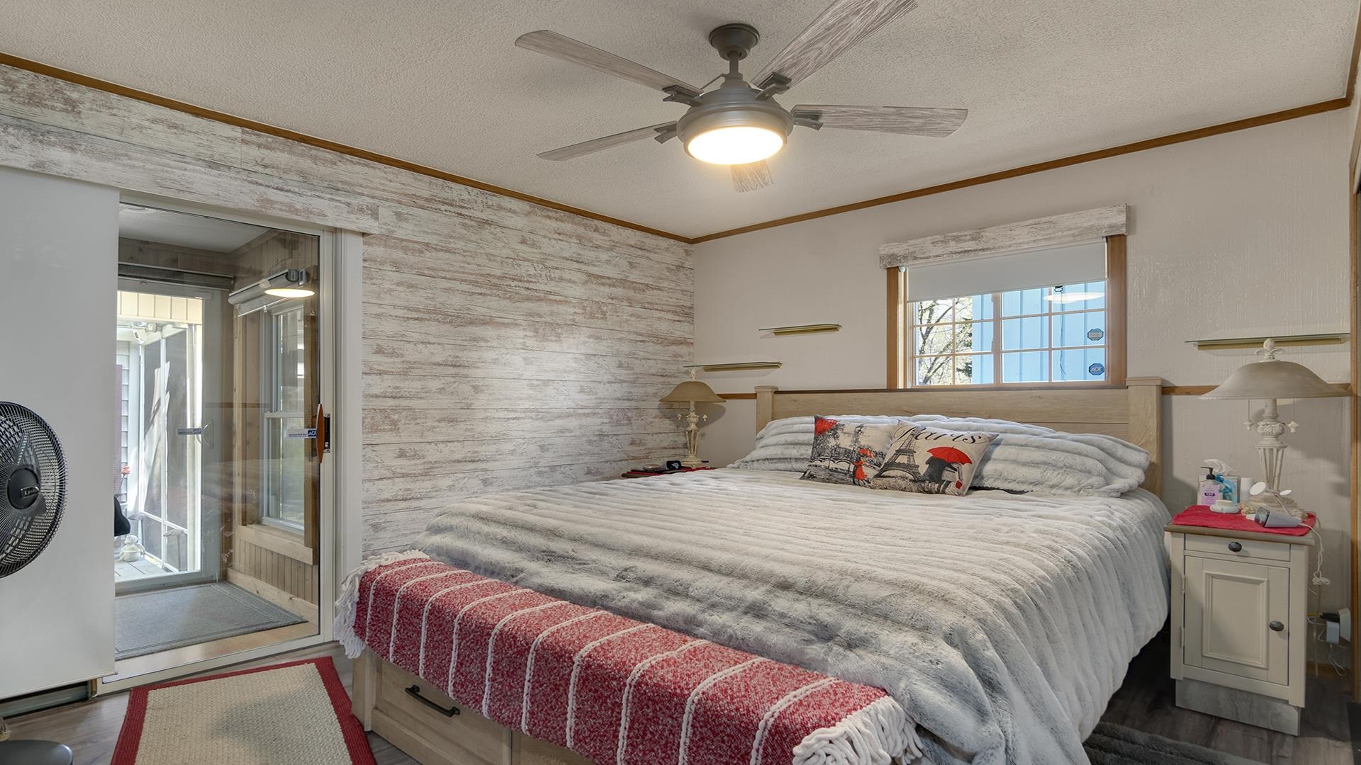 2112 South Alpine Road Rockford, IL 61108 - Photo 18 of 43 a bedroom with a bed and a chandelier
