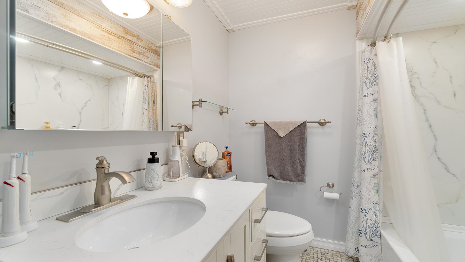 2112 South Alpine Road Rockford, IL 61108 - Photo 20 of 43 a bathroom with a sink toilet and shower