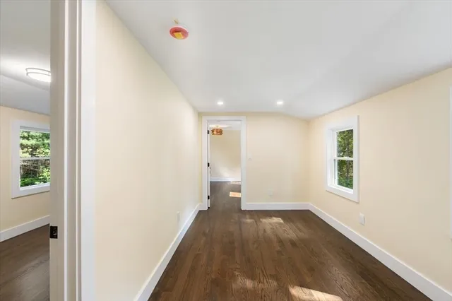 a bathroom with a toilet a sink and a mirror