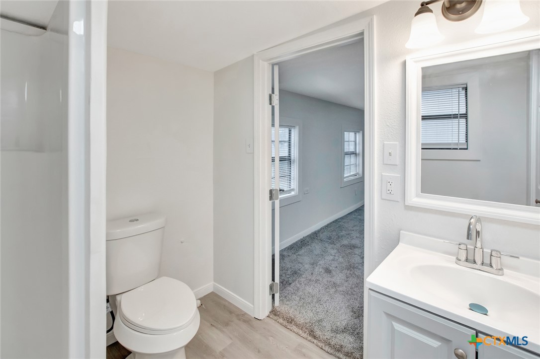 2907 Cedar Street Victoria, TX 77901 - Photo 15 of 45 a bathroom with a sink a toilet and shower