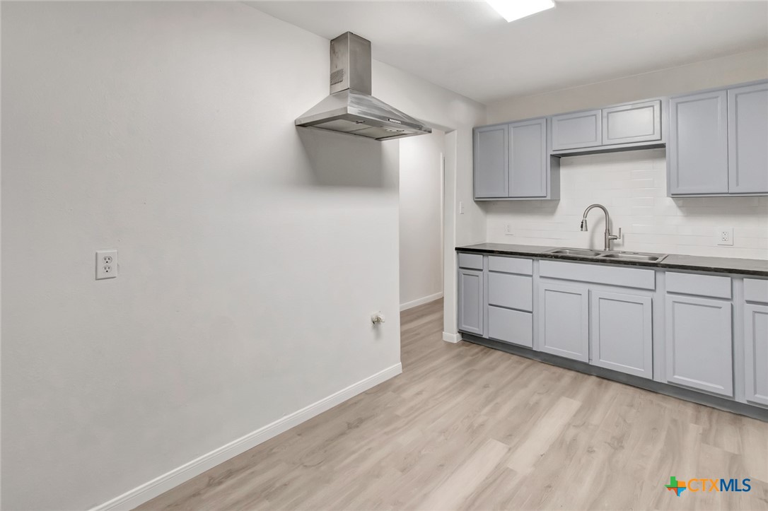 2907 Cedar Street Victoria, TX 77901 - Photo 18 of 45 a kitchen with a sink and cabinets