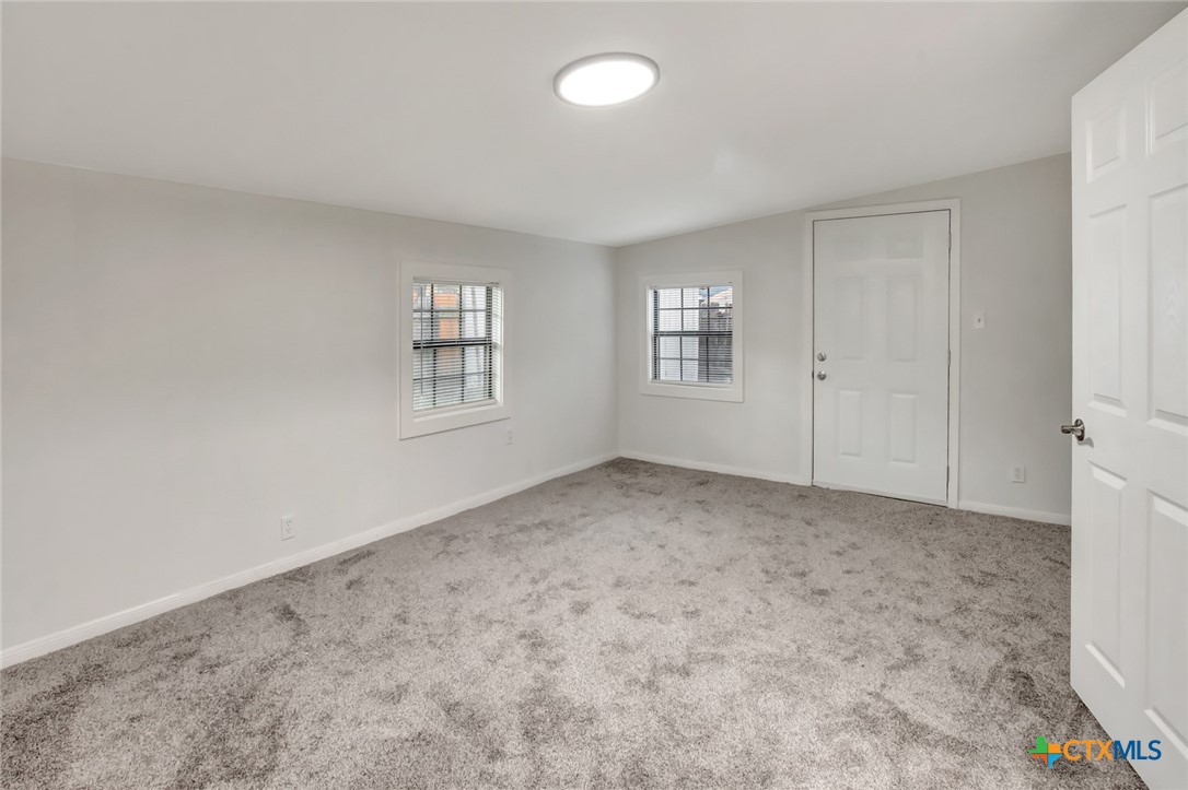 2907 Cedar Street Victoria, TX 77901 - Photo 21 of 45 a view of an empty room with a window