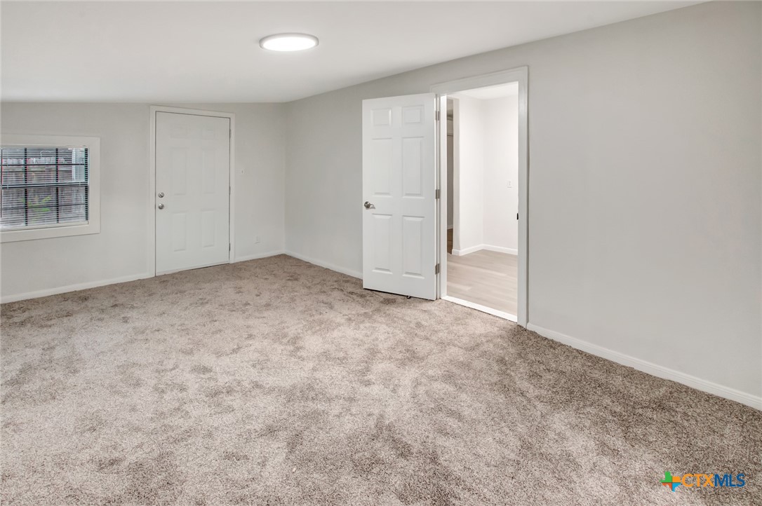 2907 Cedar Street Victoria, TX 77901 - Photo 22 of 45 an empty room with windows