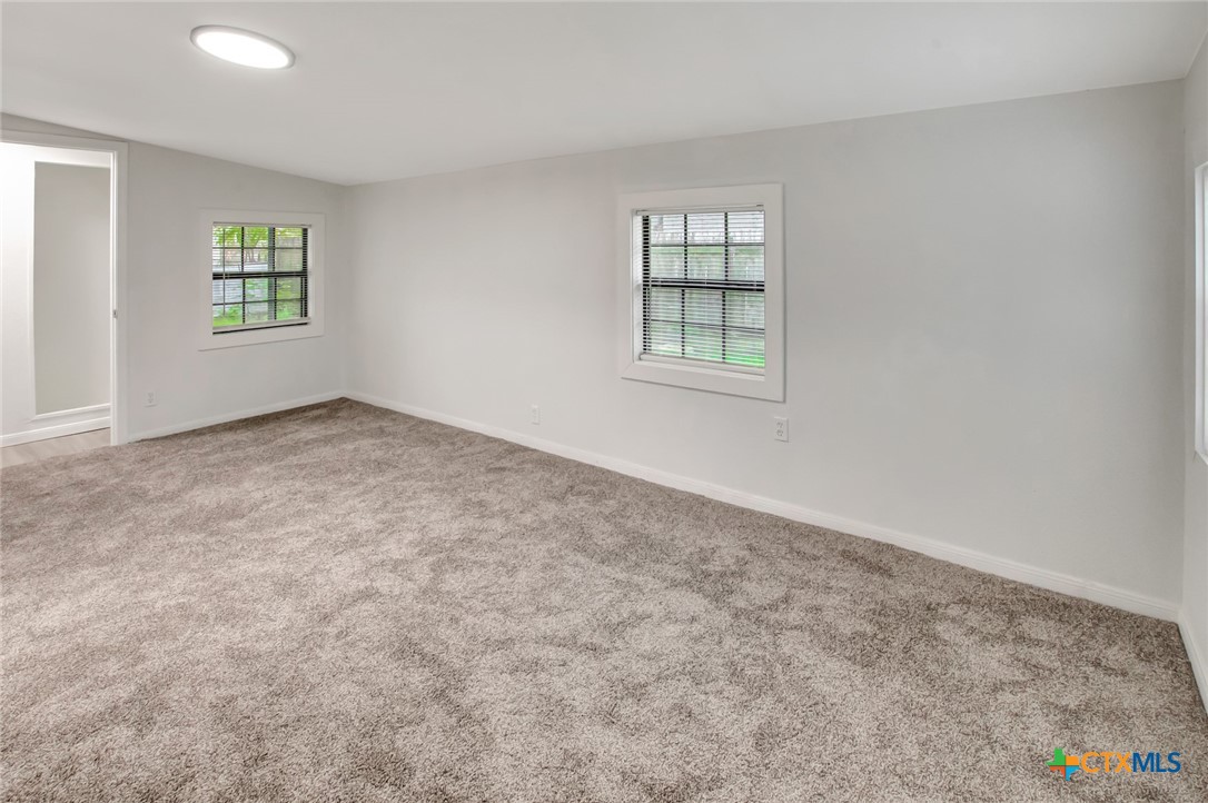 2907 Cedar Street Victoria, TX 77901 - Photo 24 of 45 an empty room with windows