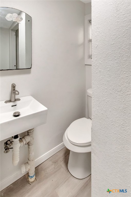 2907 Cedar Street Victoria, TX 77901 - Photo 26 of 45 a bathroom with a sink a toilet and mirror