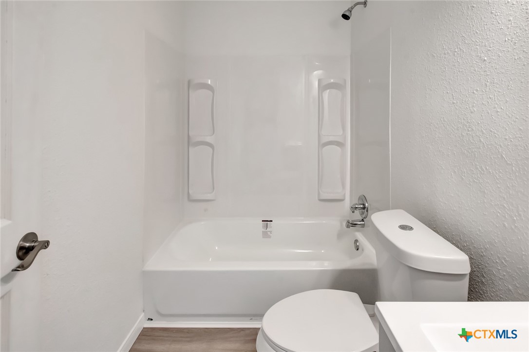 2907 Cedar Street Victoria, TX 77901 - Photo 28 of 45 a bathroom with a toilet a sink and bathtub