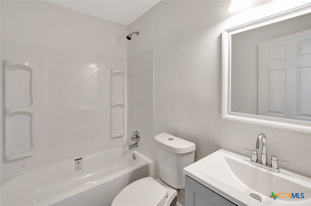2907 Cedar Street Victoria, TX 77901 - Photo 29 of 45 a bathroom with a sink toilet and a bathtub
