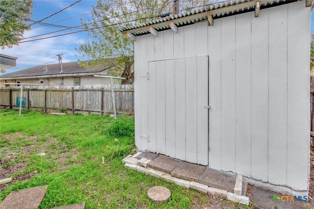 2907 Cedar Street Victoria, TX 77901 - Photo 37 of 45 a view of a backyard with a fence and plants