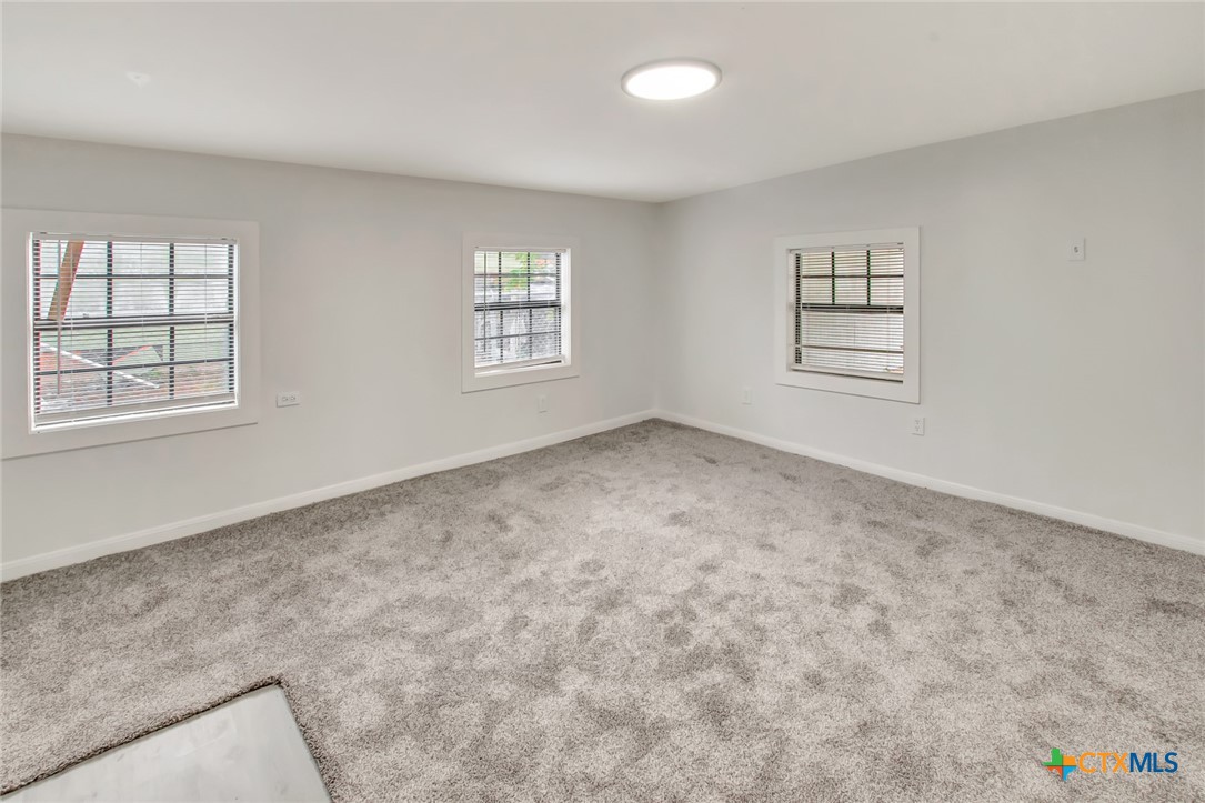 2907 Cedar Street Victoria, TX 77901 - Photo 9 of 45 an empty room with windows