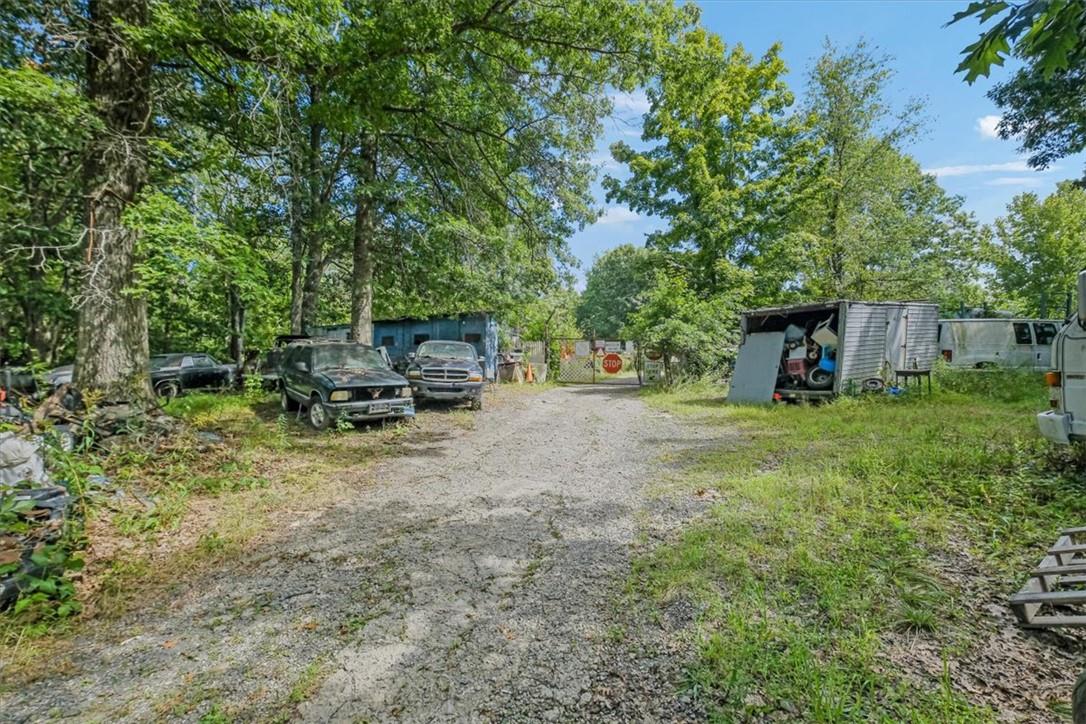 90 Freetown Road Wallkill, NY 12589 - Photo 15 of 17 a view of backyard with table and chairs and potted plants