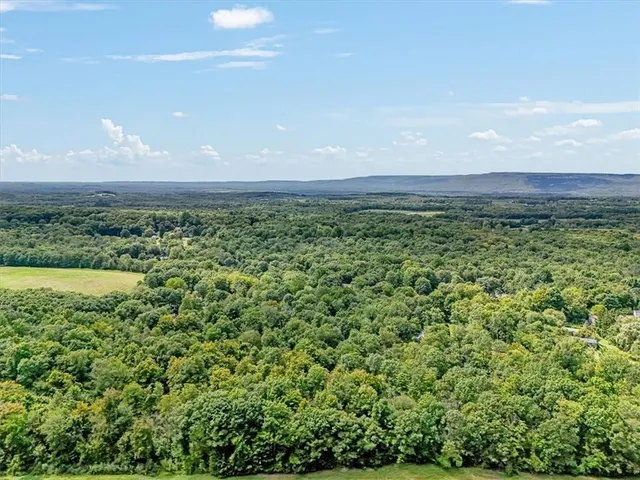 a view of a field with an outdoor space