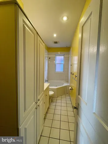 a bathroom with a shower and a bathtub