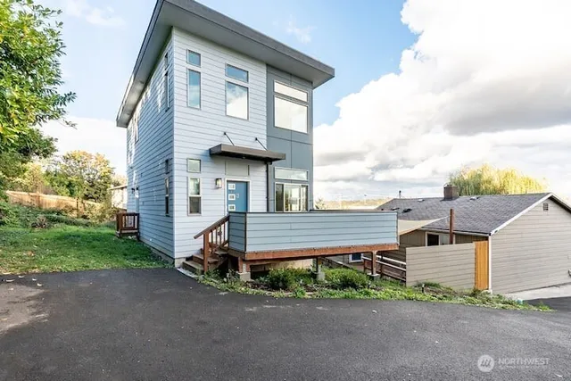 a front view of a house with a garden