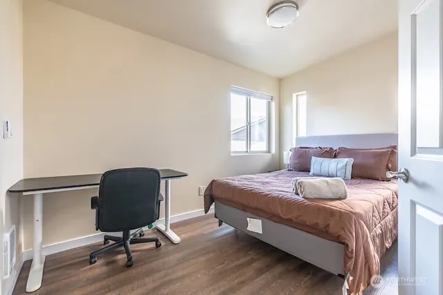 a bedroom with a bed and a chair