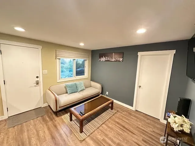 a living room with furniture and a window