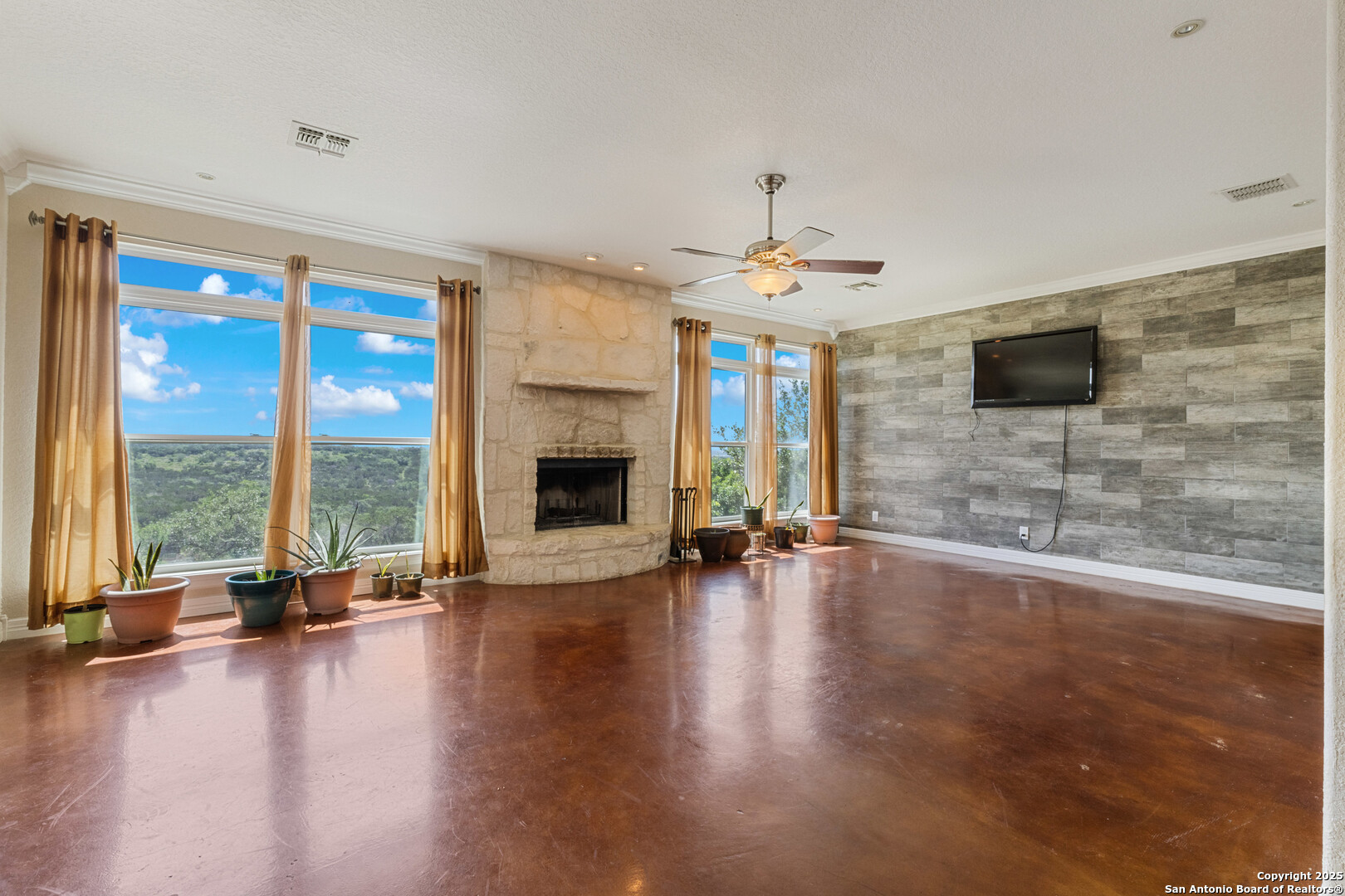 165 County Road 2740 Mico, TX 78056 - Photo 22 of 30 a view of an empty room with glass door and windows