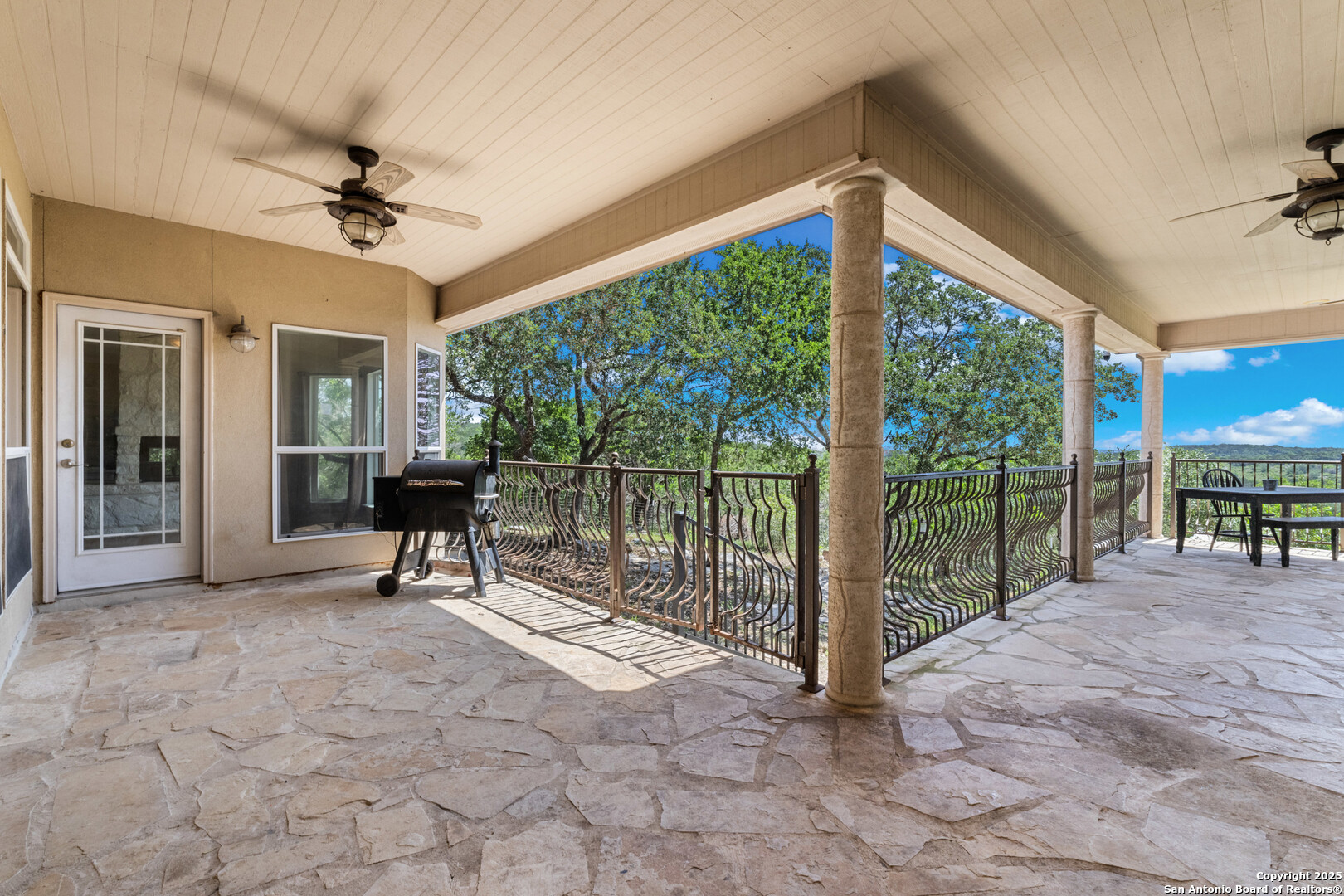 165 County Road 2740 Mico, TX 78056 - Photo 24 of 30 a view of a porch with furniture and a yard