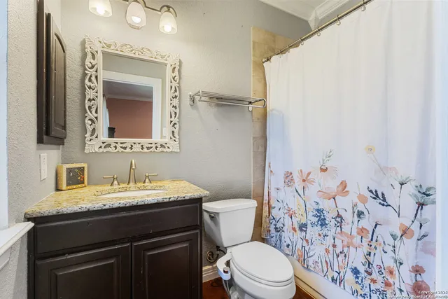 a bathroom with a sink and a toilet