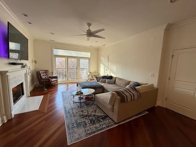 a living room with furniture fireplace and flat screen tv