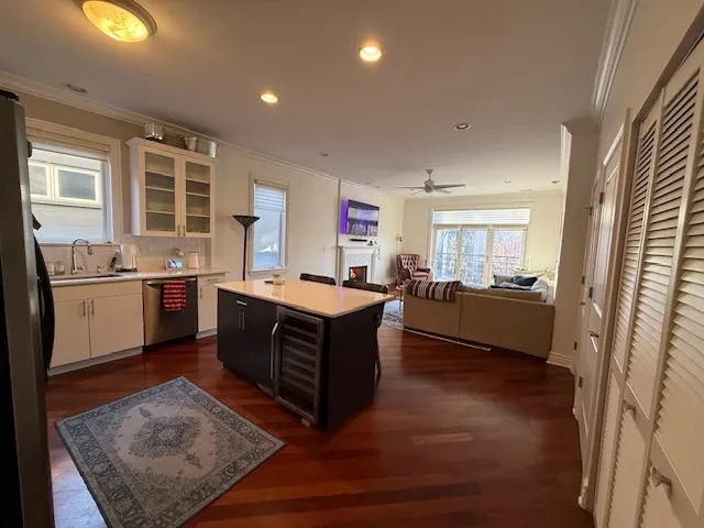 a large kitchen with stainless steel appliances granite countertop a stove a sink and a refrigerator