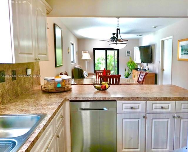 6527 West 22nd Lane Hialeah, FL 33016 - Photo 6 of 18 a kitchen with granite countertop a sink and a granite counter tops
