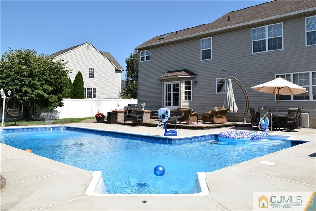32 Stratton Road Old Bridge, NJ 07747 - Photo 4 of 24 a view of a house with pool and chairs