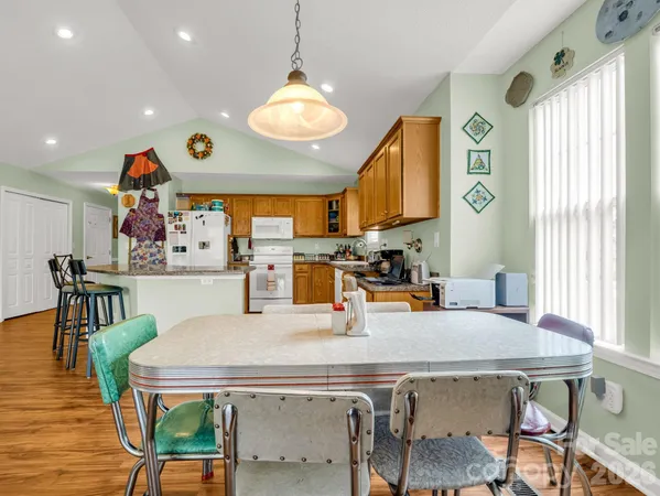 a view of kitchen dining table and chairs