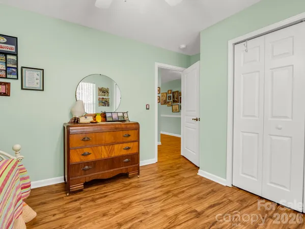 a room with a dresser and a mirror