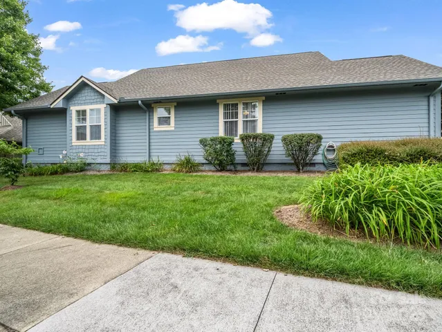 a brick house with a garden